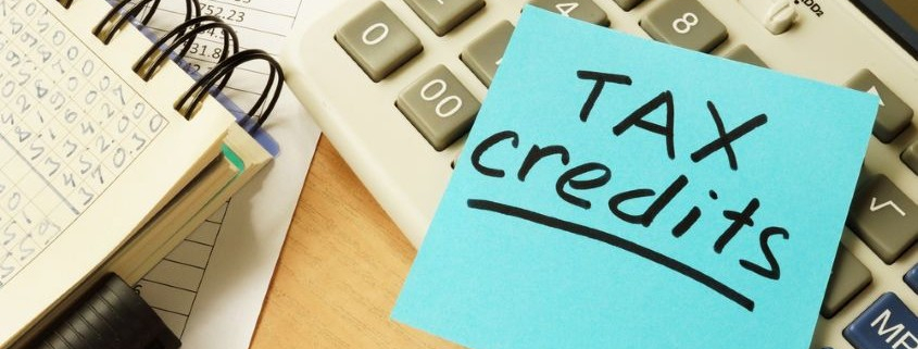 post it note with words tax credits_shutterstock_667165351 845x345